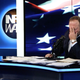 Alex Jones holds his head in his hand on August 14, 2018